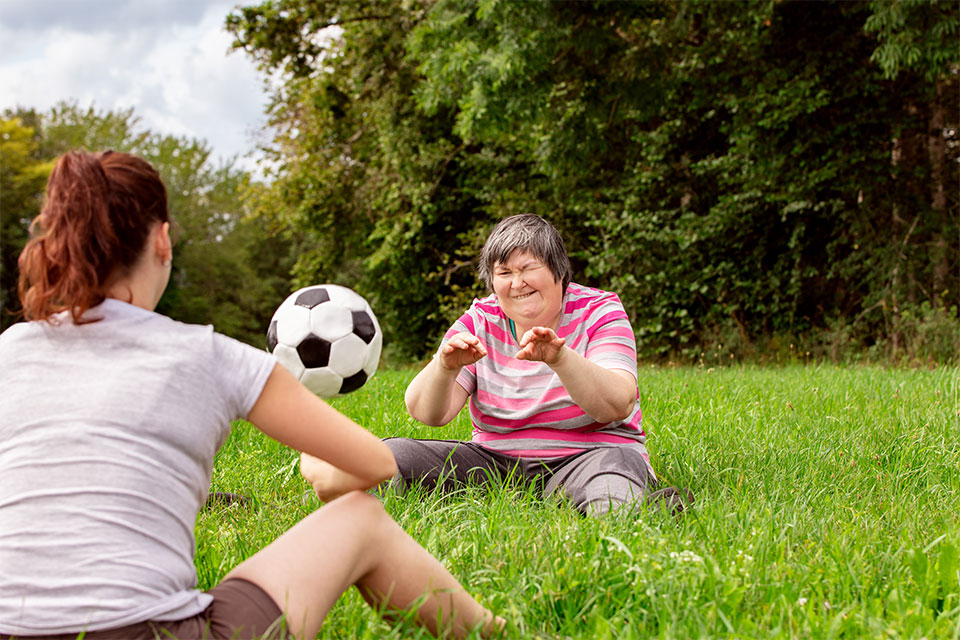 Photo of a residents playing with ball